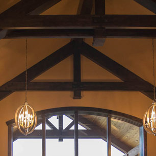 Great Room with large pendant lighting and wood beams