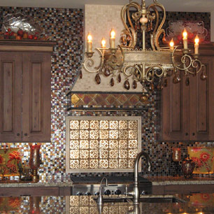Kitchen featuring granite, chandelier and tile