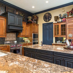 Kitchen featuring granite and tile