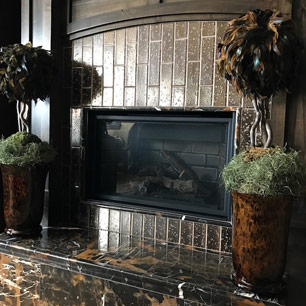 Fireplace featuring tile and marble