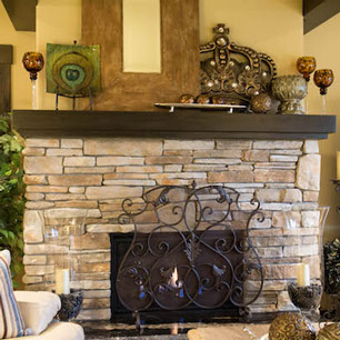Stone fireplace with granite hearth and accessories
