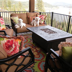 Outdoor Living featuring furniture, area rug pillows and fire table